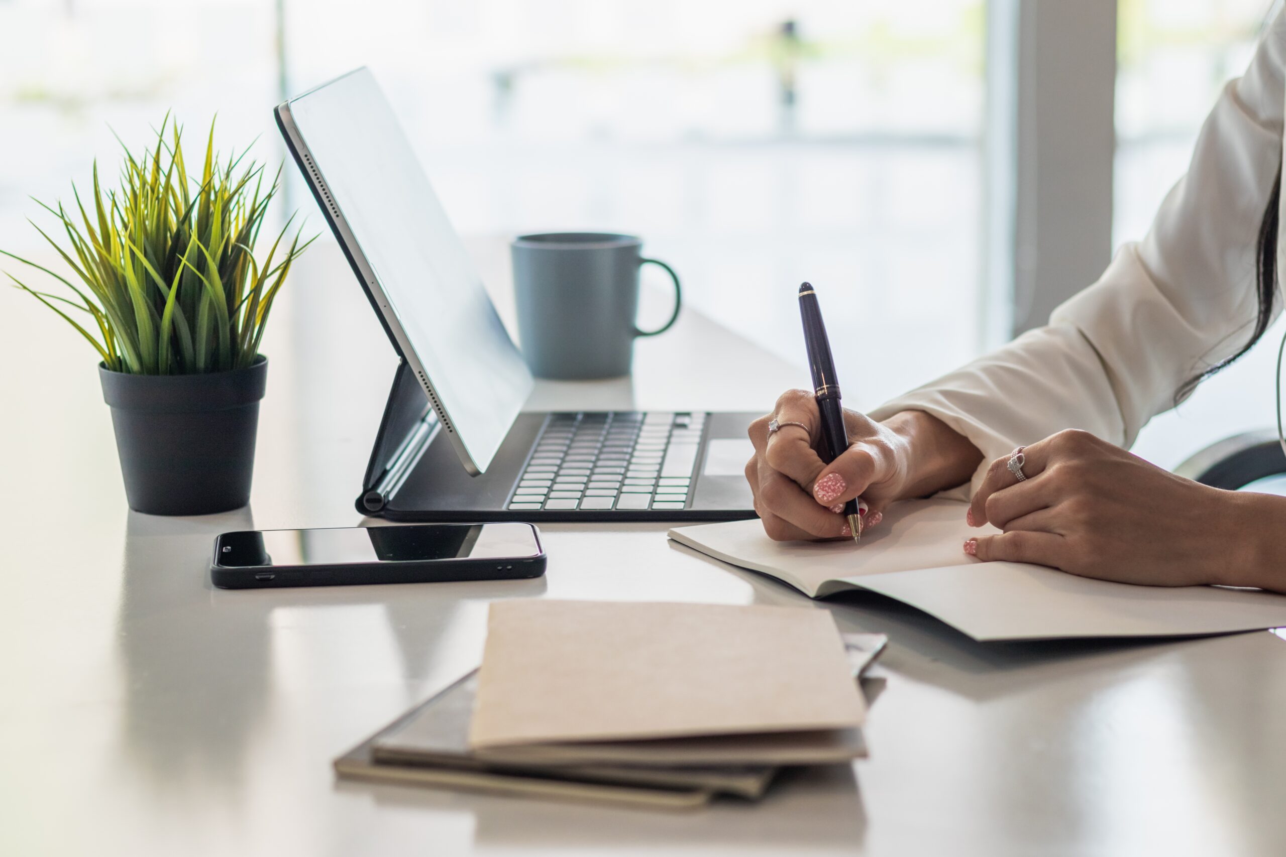 person writing a sales plan